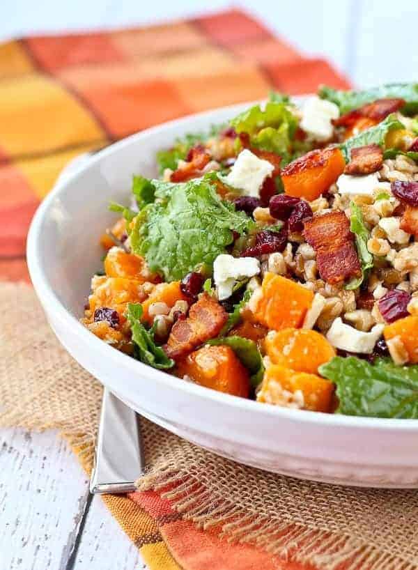 Front partial closeup of farro salad in shallow white bowl.