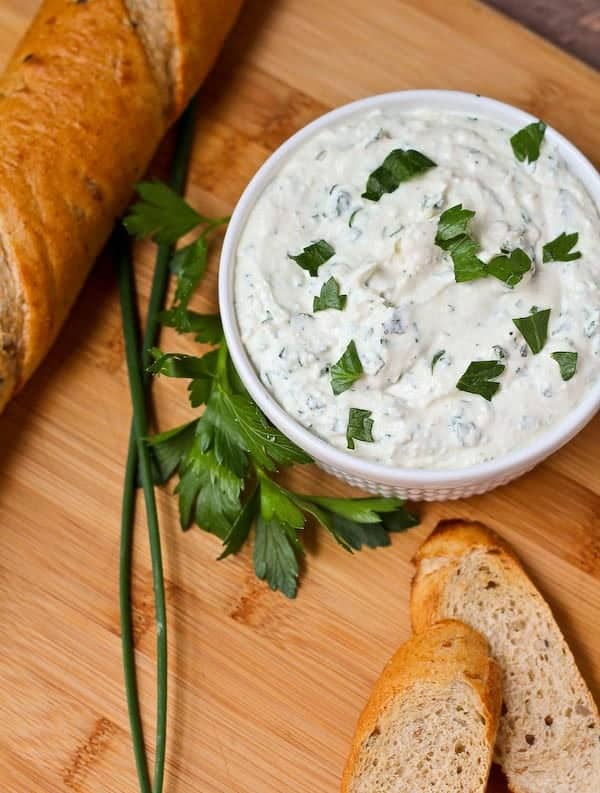 This herbed feta dip recipe will be the star of your next holiday gathering! It's tangy and unbelievably flavorful thanks to tons of fresh herbs - including one that may surprise you! Get the easy appetizer recipe on RachelCooks.com!