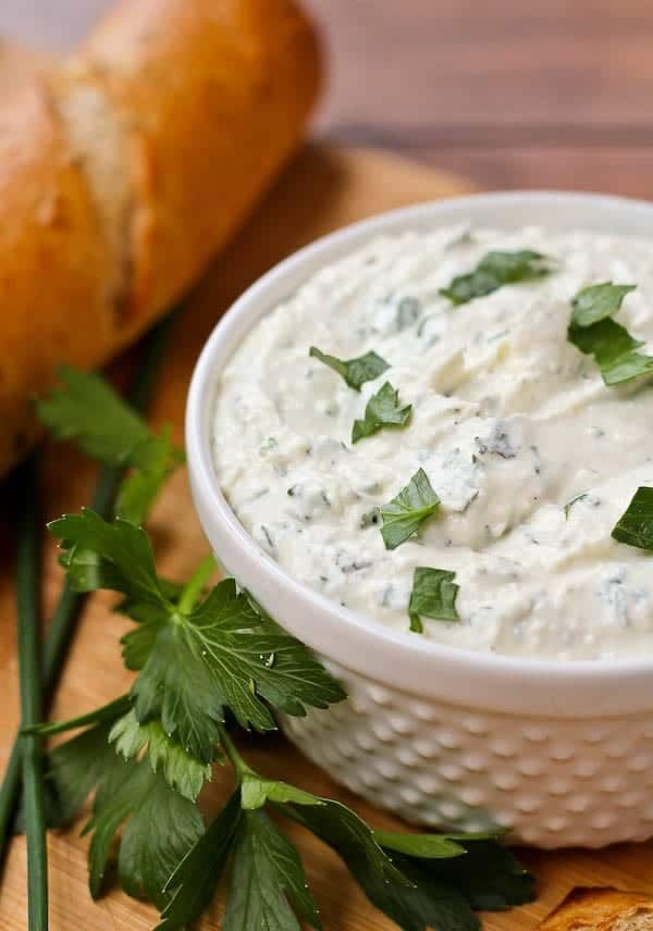 This herbed feta dip recipe will be the star of your next holiday gathering! It's tangy and unbelievably flavorful thanks to tons of fresh herbs - including one that may surprise you! Get the easy appetizer recipe on RachelCooks.com!