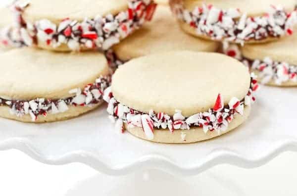 These Peppermint Sugar Cookie Sandwiches with Chocolate Ganache are easy to make and a gorgeous addition to your holiday cookies. Get the recipe on RachelCooks.com!