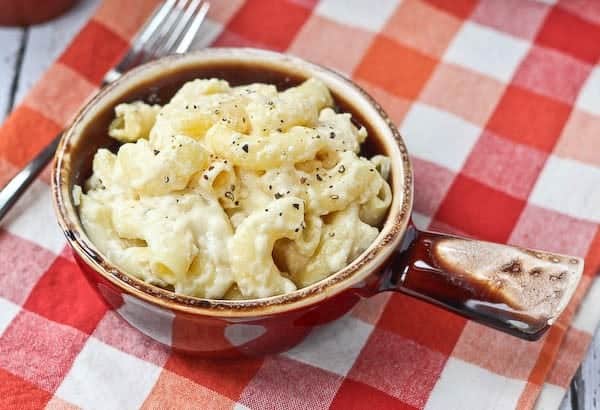 Perfect for parties, this slow cooker macaroni and cheese recipe is creamy, flavorful, and so easy to make! Get the recipe on RachelCooks.com!