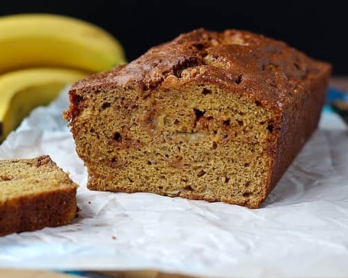This whole wheat banana bread uses very little oil and 100% whole wheat flour. The caramel bits add the perfect touch of sweetness. Get the easy quick bread recipe on RachelCooks.com!