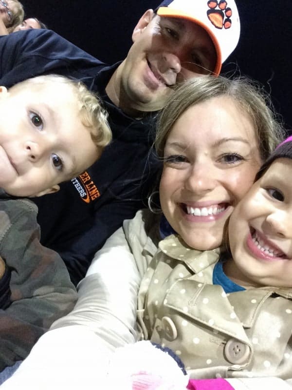 Selfie photo of author with family at football game.