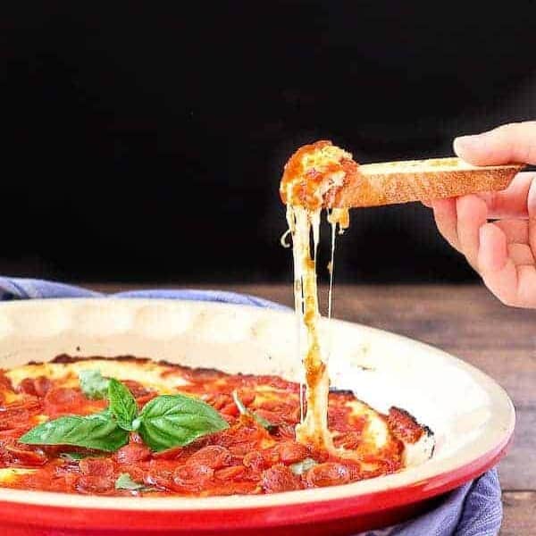 Imagine irresistible pepperoni pizza in dip form. I can't think of many things better than that. This pepperoni pizza dip will be a hit at all your parties. Get the easy appetizer recipe on RachelCooks.com!