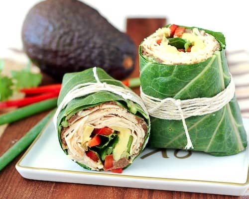 Switch up your wrap game! This southwestern collard wrap envelopes chicken, beans, red peppers, avocados, and more in a crunchy, satisfying, and colorful wrap. Get the recipe on RachelCooks.com!