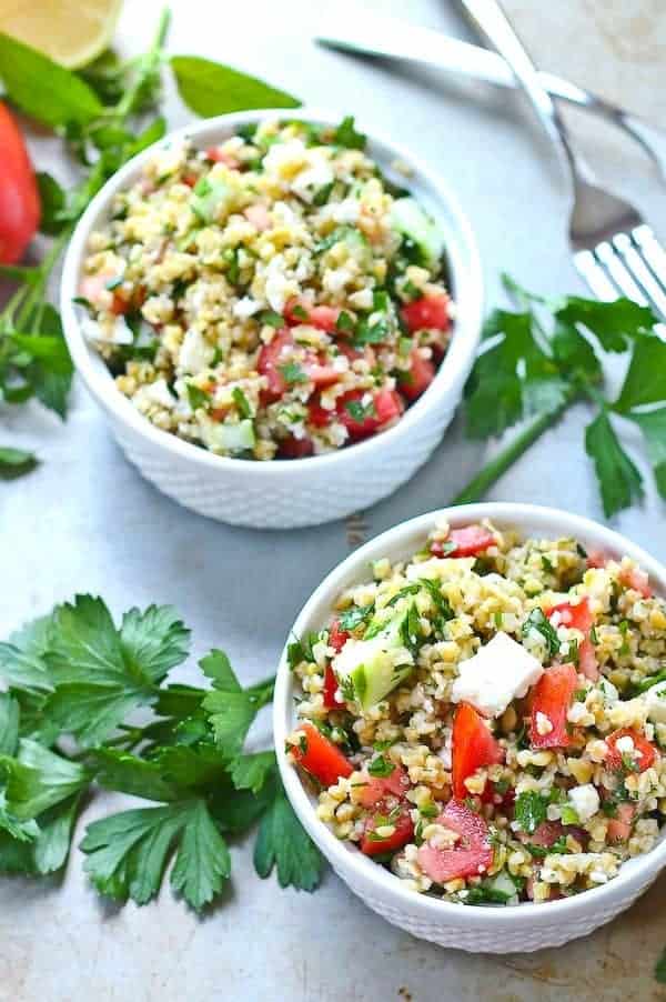 Healthy lunch alert! This tabbouleh salad recipe with freekeh and feta is a filling and satisfying lunch. Prepare to be obsessed with freekeh. Get the healthy recipe on RachelCooks.com!