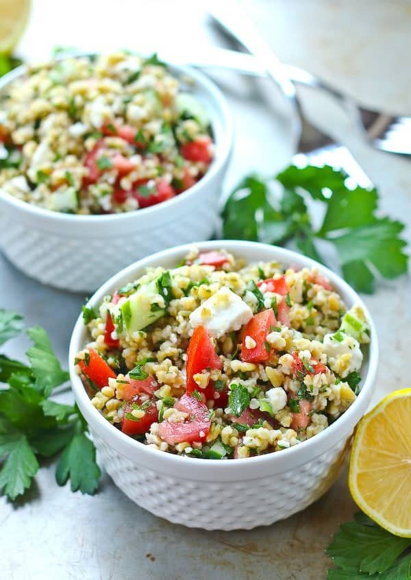 Healthy lunch alert! This tabbouleh salad recipe with freekeh and feta is a filling and satisfying lunch. Prepare to be obsessed with freekeh. Get the healthy recipe on RachelCooks.com!