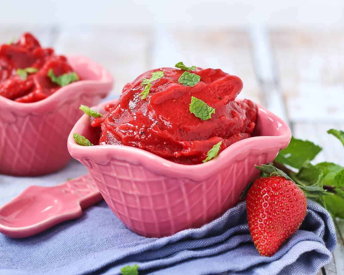 Strawberry sorbet topped with fresh mint.