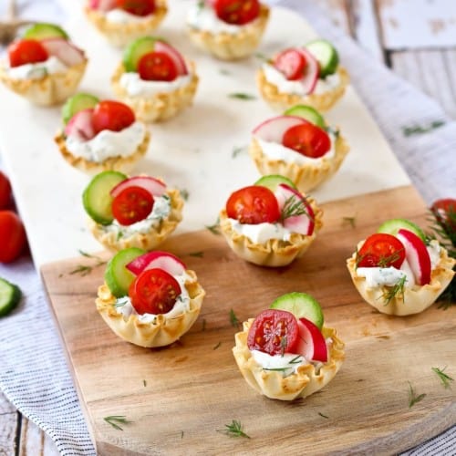 These spring herb cream cheese appetizer cups scream spring flavors and are easy to make - they come together in minutes they are a stunning addition to any appetizer spread. Get the super simple, 10 minute appetizer recipe on RachelCooks.com!