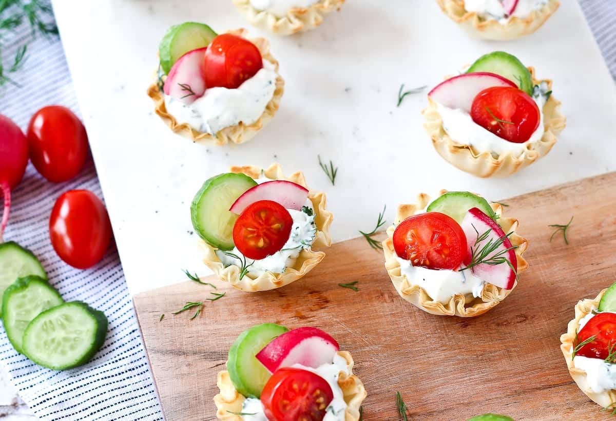 Cream cheese and spring vegetables in phyllo cups.