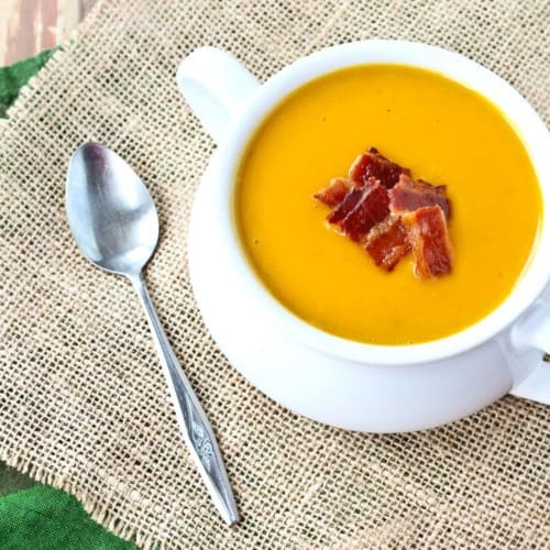Warm and soothing, this squash soup is easy to make and perfect year-round. You'll love the crispy bacon on top! Get the easy recipe on RachelCooks.com!