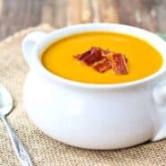 Warm and soothing, this squash soup is easy to make and perfect year-round. You'll love the crispy bacon on top! Get the easy recipe on RachelCooks.com!