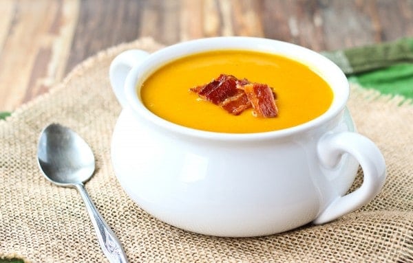 Warm and soothing, this squash soup with bacon is easy to make and perfect year-round. You won't be able to resist the crispy bacon on top! Get the easy butternut squash soup on RachelCooks.com!