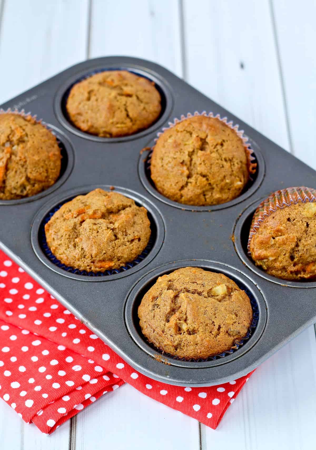 Morning glory muffins in a muffin tin.