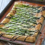 Perfect for spring, this asparagus gruyere tart is a show-stopping addition to any brunch or appetizer table. You won't believe how easy it is to make! Get the recipe on RachelCooks.com!