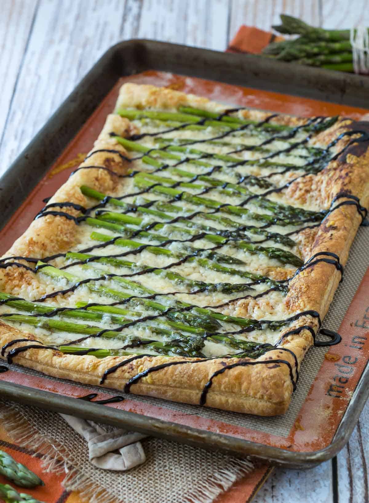 Asparagus Gruyère Tart on a sheet pan.