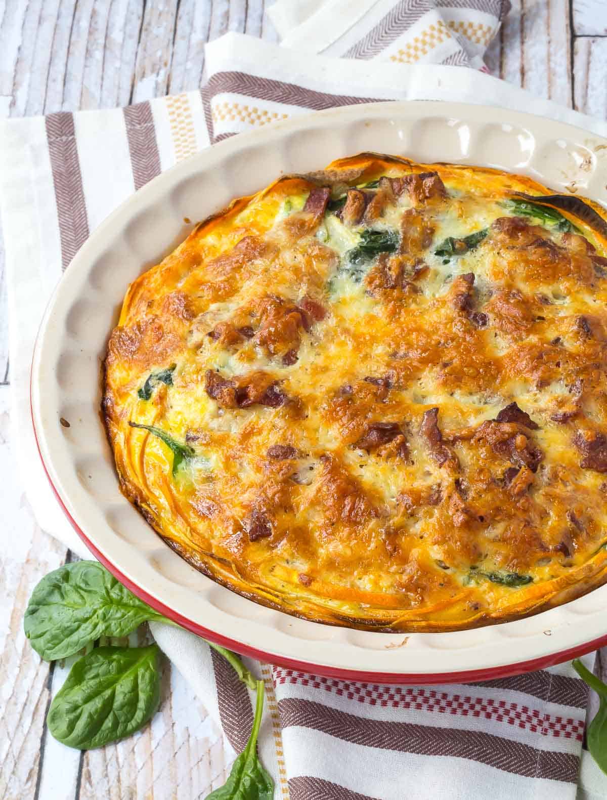 Close up overhead shot of baked quiche in pie dish.