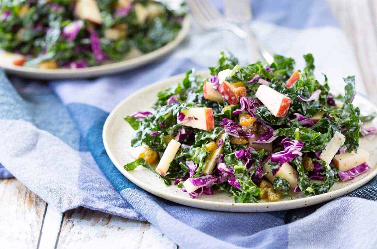 Plated salad on blue and white cloth.