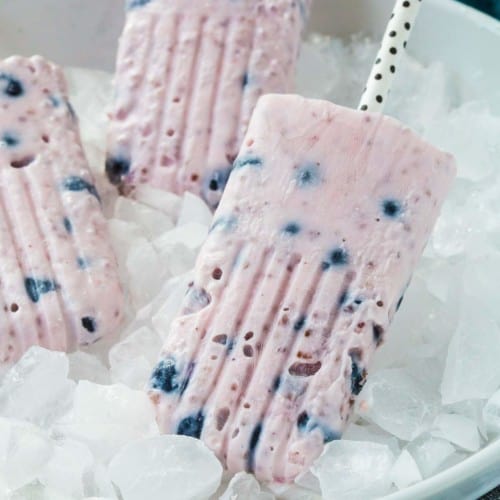Ditch the artificially flavored and unnaturally colored popsicles in favor of these yogurt popsicles with berries and chia. Your body will thank you. With only 2 ingredients, they're SO easy to make! Get the easy summer recipe on RachelCooks.com!