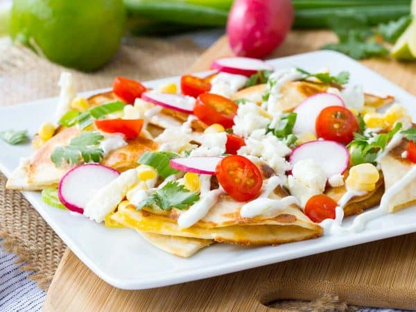 How about we put the cheese inside the “chips” and use quesadillas as the base for some summer-inspired quesadilla nachos? The result is incredible! Get the recipe on RachelCooks.com!