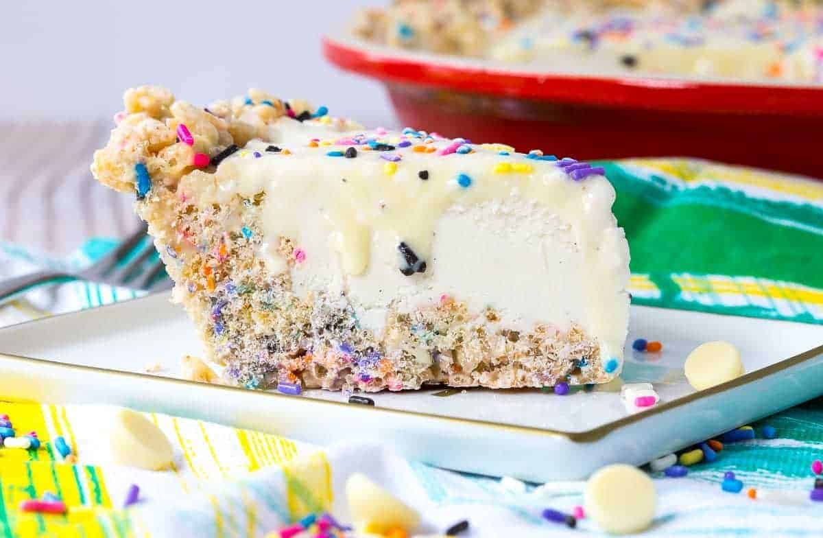 This whimsical ice cream pie recipe is perfect for any summer party - kids will love the sprinkles and adults will love the vanilla beans and white chocolate ganache. Get the recipe on RachelCooks.com!