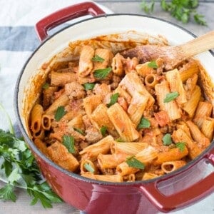 Overhead of rigatoni in red Dutch oven, ready to serve.