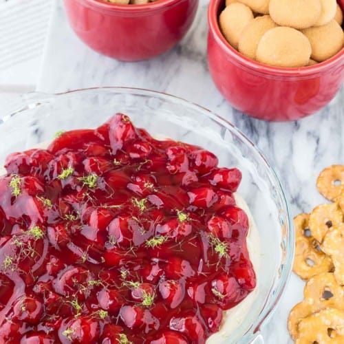This cherry cheesecake dip with lime is going to become a party favorite. It takes only minutes to make and has fresh and bright flavors thanks to lime juice and zest. Get the easy no-bake dessert recipe on RachelCooks.com! This sweet dip is going to go into regular rotation.