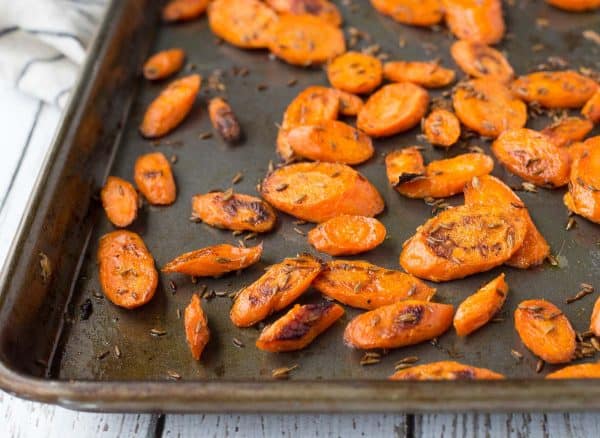 Tired of plain carrots? These roasted carrots with cumin are going to blow your mind with their punch of flavor. A fantastic, unique and healthy side dish. Get the recipe on RachelCooks.com! 