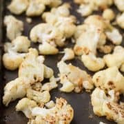 This Parmesan Roasted Cauliflower is going to become your new favorite way to eat cauliflower - it's flavorful, crispy, and so easy to prepare! Get the recipe on RachelCooks.com!