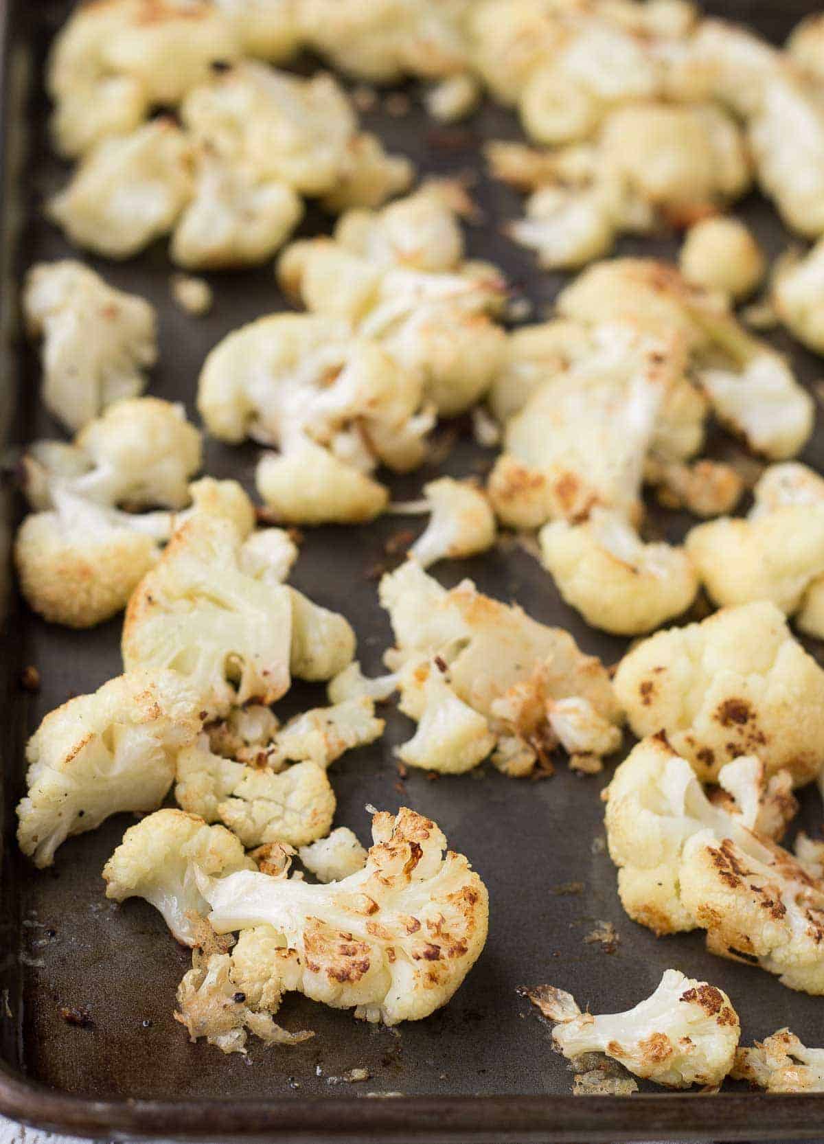 Parmesan roasted cauliflower on a sheet pan.