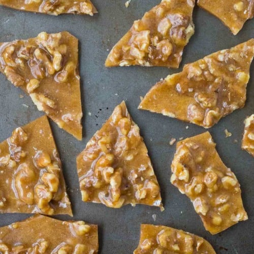 Perfect for gift giving or snacking on at parties, this Walnut Brittle with Cinnamon and Cloves is easy to make and so flavorful thanks to toasted walnuts and warm spices. Get the candy recipe on RachelCooks.com!