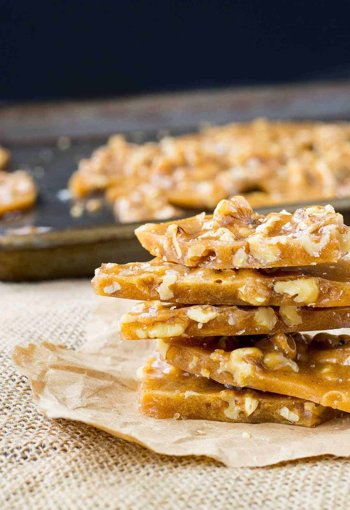 Walnut brittle pieces stacked on top of each other.