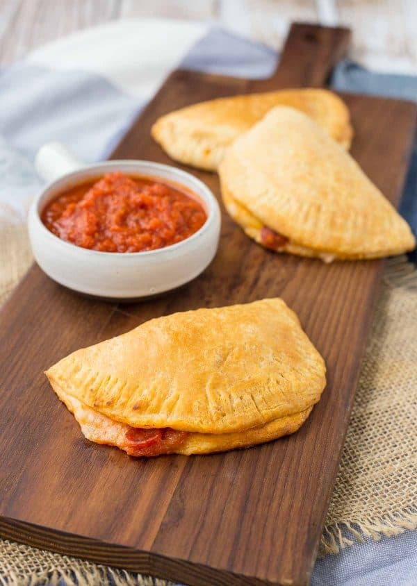 Homemade Hot Pockets are a fun alternative to pizza night and they also make for a fun surprise in lunch boxes. Get the kids involved in making this easy recipe, too! Get the easy recipe on RachelCooks.com!