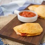 Homemade Hot Pockets are a fun alternative to pizza night and they also make for a fun surprise in lunch boxes. Get the kids involved in making this easy recipe, too! Get the easy recipe on RachelCooks.com!