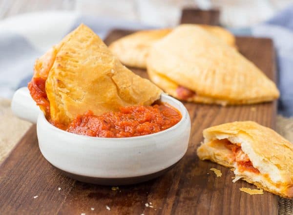 Homemade Hot Pockets are a fun alternative to pizza night and they also make for a fun surprise in lunch boxes. Get the kids involved in making this easy recipe, too! Get the easy recipe on RachelCooks.com!