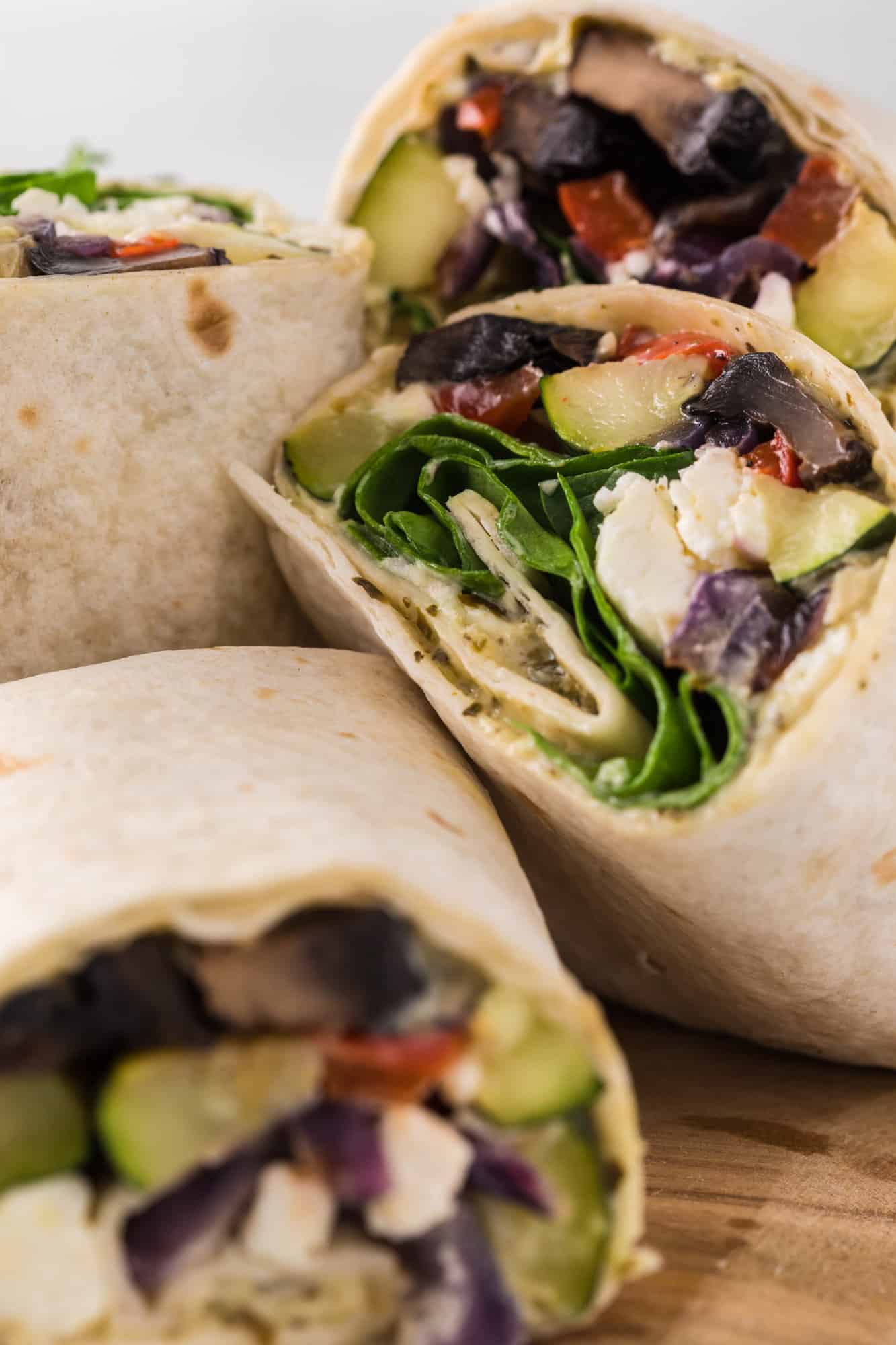 Close up of halves of roasted vegetable wraps.