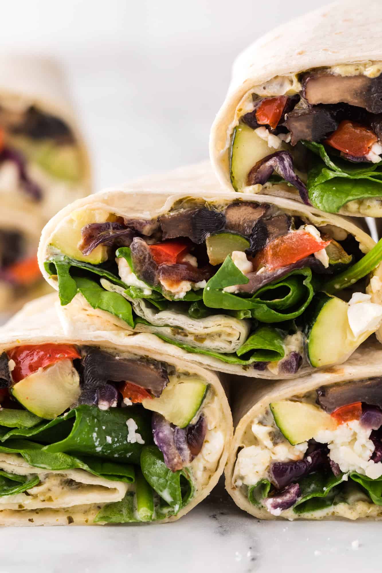 A stack of roasted vegetable wraps.