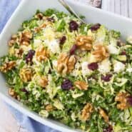 This kale quinoa salad is a healthy and hearty salad that stores well in the fridge, making it perfect for meal prep days. You'll love the crunchy walnuts and sweet, chewy cranberries! Get the salad recipe on RachelCooks.com!