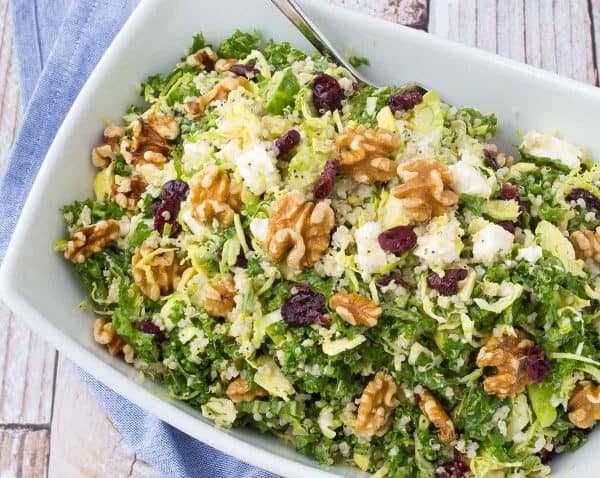 This kale quinoa salad is a healthy and hearty salad that stores well in the fridge, making it perfect for meal prep days. You'll love the crunchy walnuts and sweet, chewy cranberries! Get the salad recipe on RachelCooks.com!