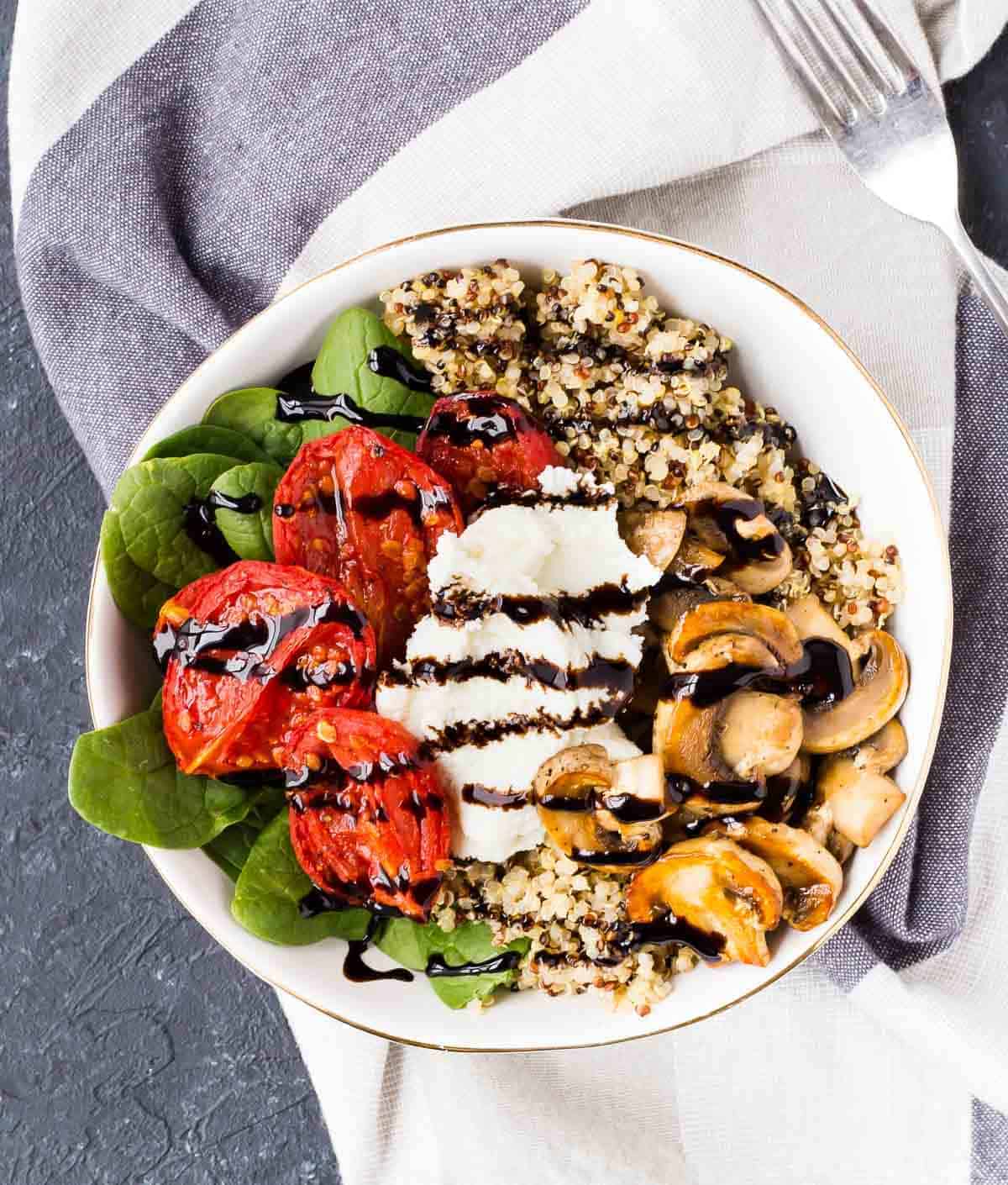 Overhead of shallow white bowl containing salad.