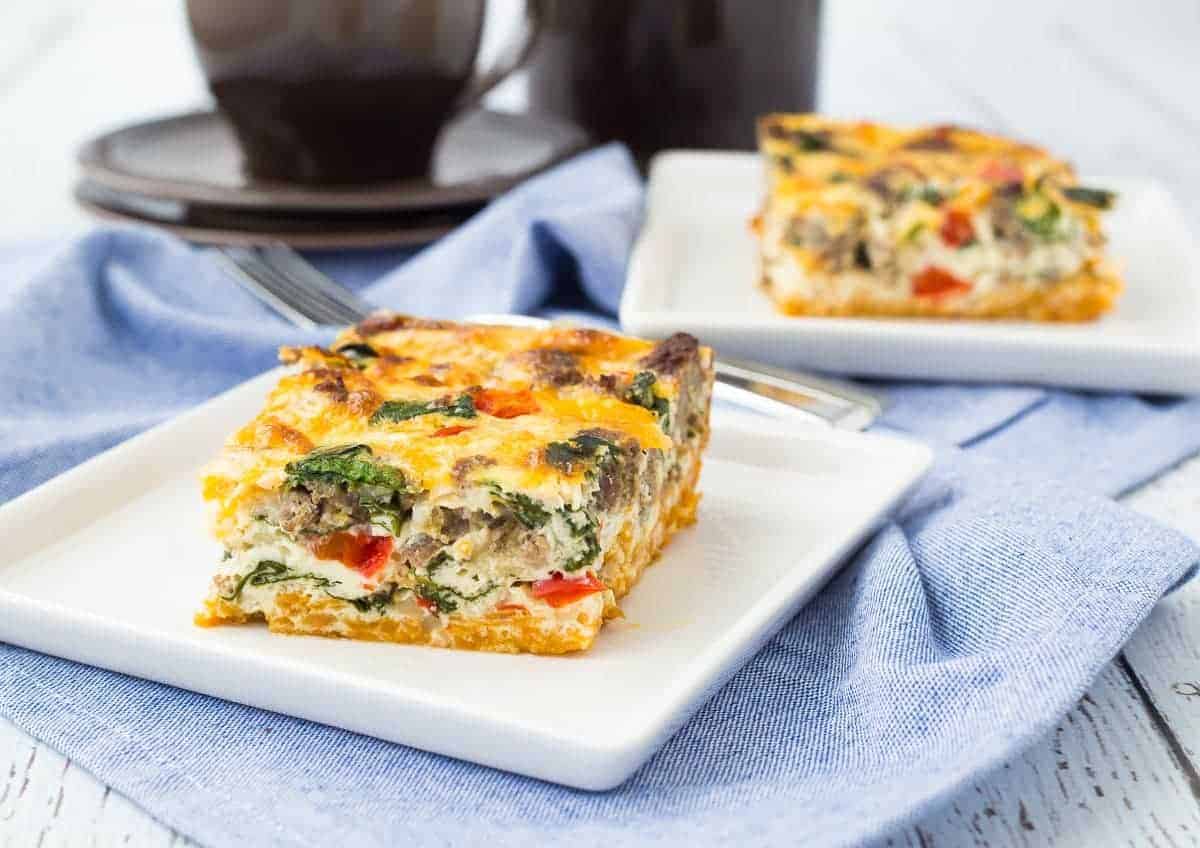 A square of egg white casserole on white plate.