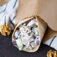 Chicken wrap in brown paper wrapping.