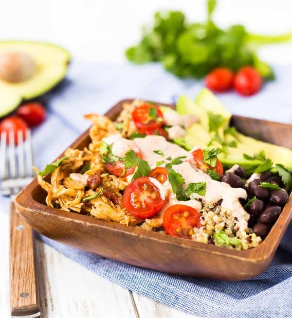Front shot of quinoa bowl on blue striped cloth.