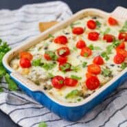 Baked quinoa casserole in blue rectangular baking dish.