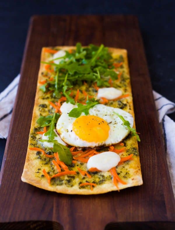 This pesto flatbread pizza is the perfect thing to get you out of your lunch rut. Ready in 15 minutes, it's a quick and easy way to have a flavorful and filling lunch. Get the recipe on RachelCooks.com!