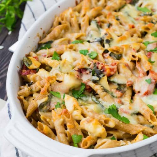 Baked pasta in white oval casserole dish.