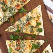 Kale Flatbread with Parmesan and Sundried Tomatoes is a quick and easy lunch or a fun appetizer for any gathering. It's packed with flavor and nutrition!
