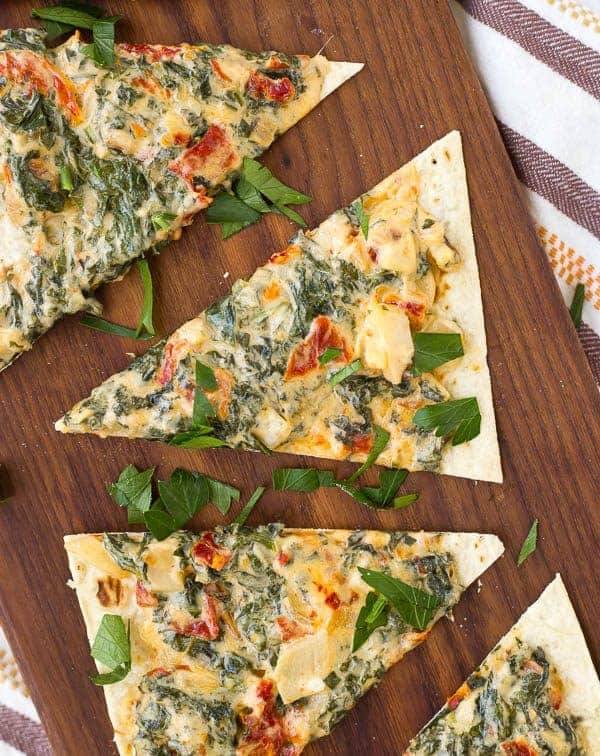 Kale Flatbread with Parmesan and Sundried Tomatoes is a quick and easy lunch or a fun appetizer for any gathering. It's packed with flavor and nutrition! 