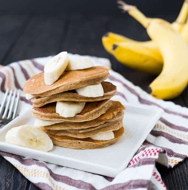 Banana pancakes layered with sliced bananas.