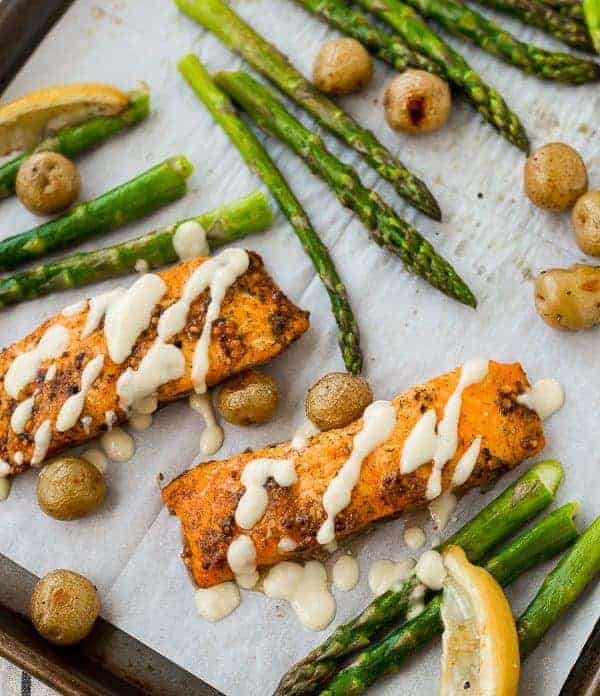 This Salmon and Asparagus Sheet Pan Dinner with Potatoes is the easiest dinner thanks to a delicious shortcut! Even if you're intimidated by cooking fish, you can handle this recipe! Get the recipe on RachelCooks.com!